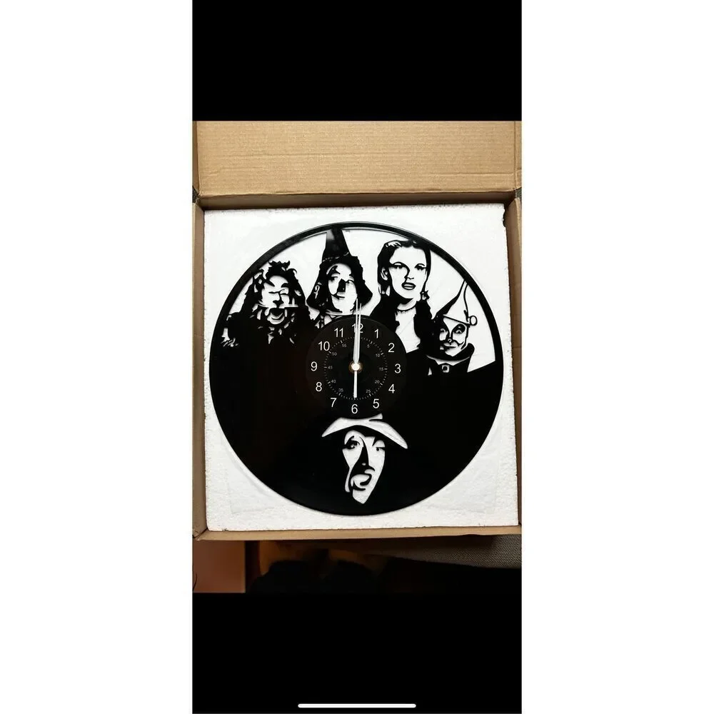 Wizard of Oz black metal clock aprox 12” in diameter